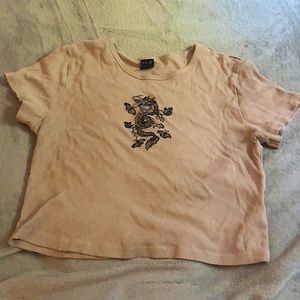 Crop top with a black dragon and butterflies A cream/tan color